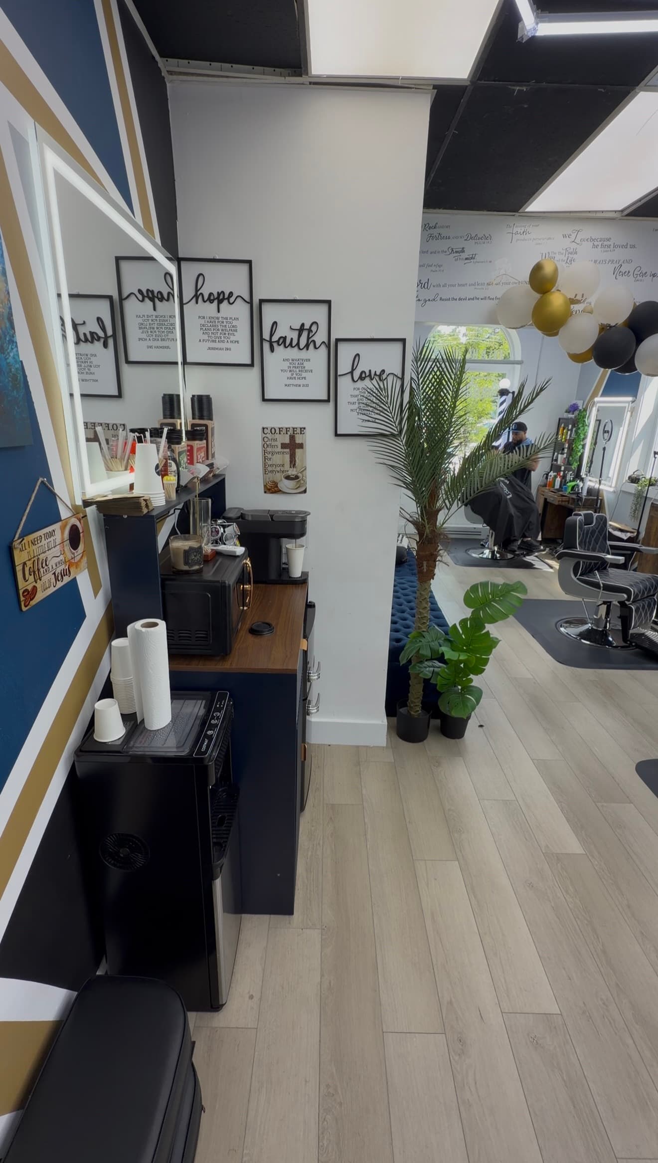 Coffee bar under hope, faith, and love scripture signs at Soto Time Cuts
